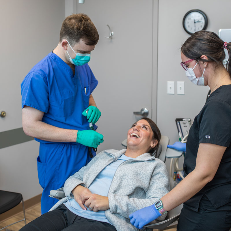 dentist and patient in chair